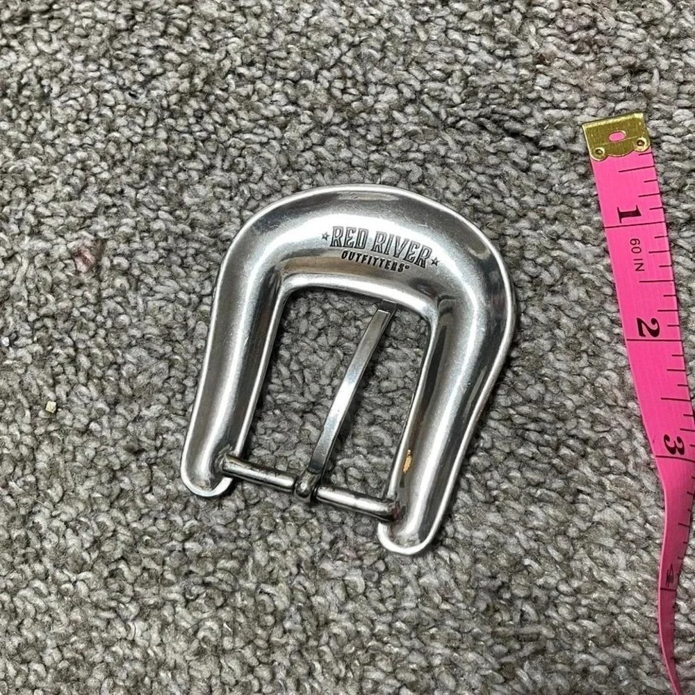 silver belt buckle with floral detailing